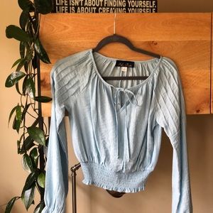Light blue blouse.